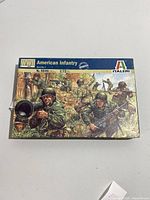 Front of the box showing colorful artwork of American infantry soldiers in WWII combat scene, Italeri branding, and scale 1:72