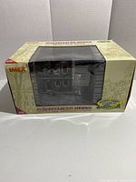 Front view of the IMEX Battlefield Ruins box showing the model inside the packaging, unopened and new.