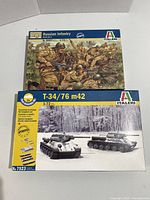 Box fronts showing the Italian brand WWII Russian Infantry and T-34/76 m42 tank model kits in 1/72 scale.
