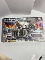Box front showing Italeri branded Stalingrad Siege 1942 Tractor Plant Assault model kit with scene of soldiers, tanks, and damaged buildings.