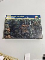 Front view of Italeri model kit box showing artwork of German Elite Troops in WWII forest setting, labeled 1:72 scale, item 6068