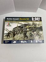 Front box image of Italeri Bunker Assault Diorama Set model kit, showing art of soldiers attacking bunker with weapons. Scale 1:72, model number 6172, D-Day Normandy 1944 theme.