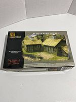Box front showing artwork of two completed Russian farm houses model in 1:72 scale by Pegasus Hobbies.