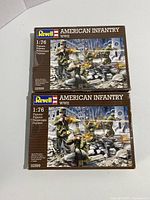 Two sealed boxes of Revell American Infantry WW2 plastic model kits showing front box art with soldier poses and scene.