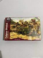 Front of boxed plastic model kit depicting World War II Folgore Division Infantry soldiers engaging in combat.