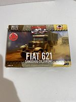 Front box cover of the Wrzesien FIAT 621 1/72 plastic model kit showing the truck in olive drab camouflage and the model name.