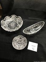 Three cut crystal serving pieces displayed