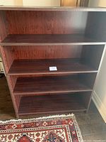 Front view showing four adjustable shelves and interior condition