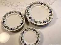 Stacks of dinner, luncheon and side plates showing pattern and quantity