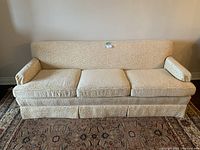 Front view showing full sofa, cushions, armrests, patterned fabric