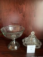 Both pressed glass pieces side by side on shelf