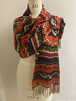 Shawl draped on mannequin showing full length and fringe