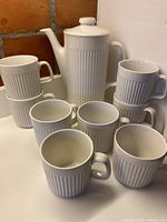 Full set showing coffee pot and eight mugs