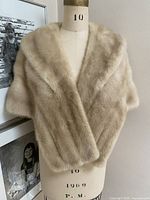 Front view of blond mink wrap on dress form