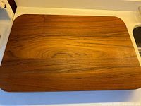 Top view of teak rectangular lazy Susan showing grain and overall form