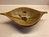 Top view of Wyatt Art Pottery leaf-shaped drip glaze bowl showing overall shape and glaze