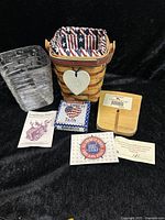 Longaberger 1995 Carry Along Basket with patterned fabric liner, plastic liner sealed in plastic, wooden 4-way divider, All American Tie-On box, and informational inserts