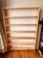 Front view of the solid pine shelving unit showing 6 open shelves and overall height and proportions.