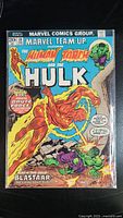 Front cover view showing full comic book cover with title and characters Human Torch and Hulk in a battle scene