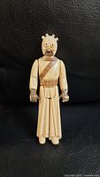 Front view of 1977 Star Wars Tusken Raider action figure showing detailed face mask, bandolier, and traditional robes.