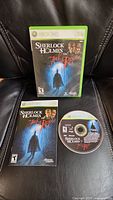 Front cover of Xbox 360 game case showing Sherlock Holmes vs Jack the Ripper artwork and game rating.