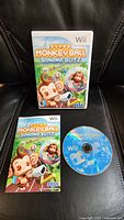 Front view of the game case, instruction manual, and game disc for Super Monkey Ball Banana Blitz for Nintendo Wii.