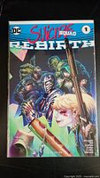 Front cover of Suicide Squad Rebirth #1 comic book variant by Philip Tan showing multiple characters in action pose.