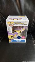Front view of sealed Funko Pop box showing the Aipom figure inside, with Pop! Games and Pokemon branding, figure number 947.