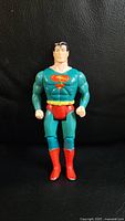 Front view of vintage Superman figure showing torso and emblem details