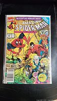 Full front view of The Amazing Spider-Man comic book issue 343, colorful cover, protected in a plastic sleeve