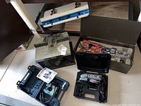 Multiple items displayed together on floor and shelf