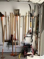 Full overview of tools mounted on wall and pressure washer