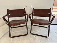 Front view of both chairs side by side on carpeted floor