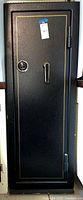 Full exterior front view of tall black safe showing door with pinstripe trim, lock and handle