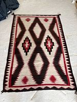 Full view of flatwoven wool rug laid flat