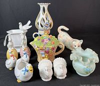 Full view of the lot showing all porcelain items arranged against black backdrop.