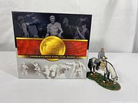 Miniature figurine of General Robert E. Lee on horseback next to the original box with Conte Collectibles logo and artwork