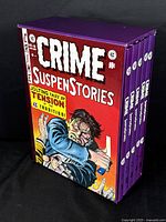 Front three-quarter view of purple slipcase with Volume 1 cover art.