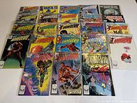 Group shot of all Daredevil comic issues arranged in 3 rows, showing all cover art with plastic protective sleeves.