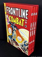 Three hardcover comics volumes in matching red slipcase with Frontline Combat cover art.