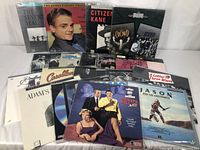 Wide view of assorted classic laser discs arranged in two rows showing cover art from citizen Kane, Casablanca, Breakfast at Tiffany's, Jason and the Argonauts and more.