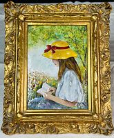 Full view of the enamel painting showing the girl reading in a garden scene with the ornate gold frame.