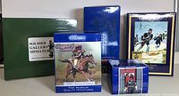 Various packaging boxes for miniature soldiers including Chasseur In Pursuit, Berlin 1938 LAH Officer and US Marines 1861-1865 models in original packaging