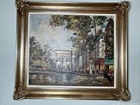 Frontal image of framed oil on canvas of Paris street scene with Arc de Triomphe, showing full view of painting and frame.