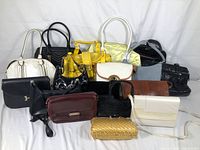 Overview of all 13 purses arranged on white background