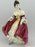 Front left angled view of the Royal Doulton Southern Belle figurine, showing detailed dress and face.