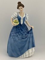 Front view of Royal Doulton figurine Helen HN 3601 showing full figure and detail of dress and bouquet.