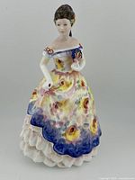 Front view of the Royal Doulton Rosemary figurine showcasing the detailed floral gown and facial features.