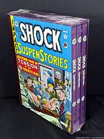 Three-volume set in original shrinkwrap, slipcase view at angle
