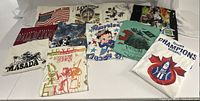 Overview of 10 assorted vintage graphic t-shirts showing various themes and designs